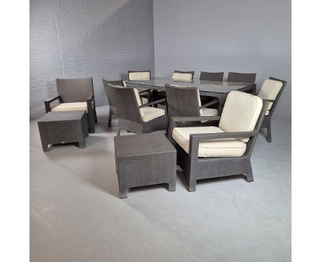 KETTAL GARDEN FURNITURE. in a woven all weather material, comprising a dining table with a glass top 78cm t x 220cm l x 110cm