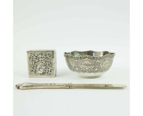 THREE PIECES OF SILVER AND WHITE METAL. comprising a Persian white metal bowl with engraved decoration, a Cambodian white met
