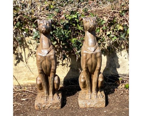 A PAIR OF GARDEN DOG STATUES. ceramic, 80cm H x 25cm W x 25cm D.