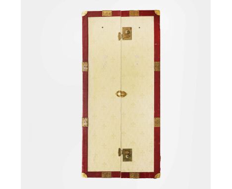 AN ASPREY WARDROBE STEAMER TRUNK WITH RED LEATHER TRIM AND BRASSWARE. Fitted with hangers  119cm H x 54cm W x 58cm D.