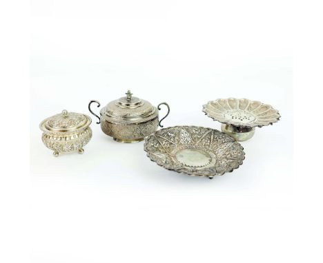 FOUR VARIOUS WHITE METAL BOWLS. comprising a Persian twin handled bowl and cover, elaborately engraved, a pot pourri bowl and