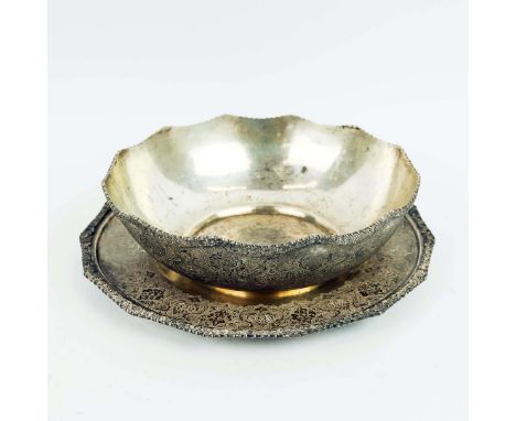 A PERSIAN WHITE METAL BOWL AND MATCHING TRAY. probably late 19th century, both elaborately engraved and with a raised borders