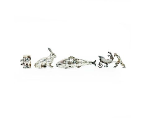 A COLLECTION OF WHITE METAL NOVELTY ITEMS. comprising a pepperette in the form of a hare, a figural salt cellarette in the fo