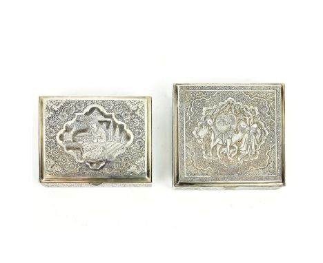 TWO PERSIAN WHITE METAL BOXES. probably early 20th century, one depicting warriors with camels, the other depicting a woman i