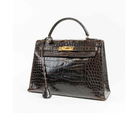 HERMÈS VINTAGE KELLY 28 IN BROWN POROSUS CROCODILE. purchased early 1980’s from Hermès Old Bond Street, London, gold metal ha