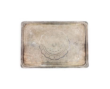 A PERSIAN WHITE METAL TRAY. probably 19th century, elaborately engraved throughout, raised border, stamped to underside, 37cm