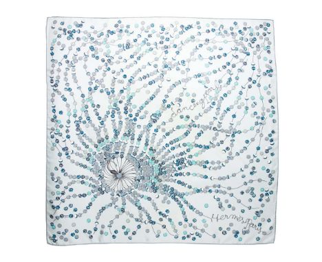 HERMÈS SCARF “DANCING PEARLS”. designed by Virgine Jamin, on a silvery light blue ground printed with patterned 'pearls',  90