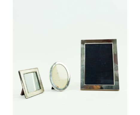 THREE VARIOUS PHOTO FRAMES. comprising a Tiffany silver oval portrait frame, a large silver plated photo frame and a Christof
