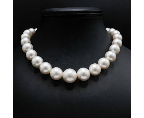 A SINGLE STRAND PEARL CHOKER NECKLACE. fitted with 29 round cultured pearls, each of approximately 16mm diameter, fitted with
