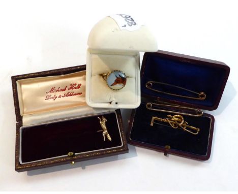 Three Cased Items of Fox Hunting Jewellery, comprising an enamelled ring, a brooch and a tie pin
