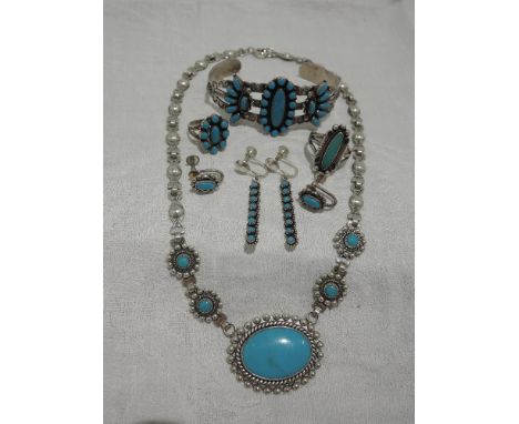 A selection of white metal and turquoise jewellery stamped sterling including cuff bangle, rings, earrings and necklace 