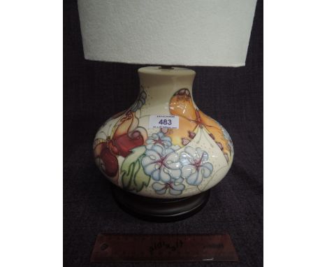 A Moorcroft table lamp in the Butterfly pattern on cream ground by Rachel BishopAPPROX 6" HIGH WITHOUT STAND AND SHADE