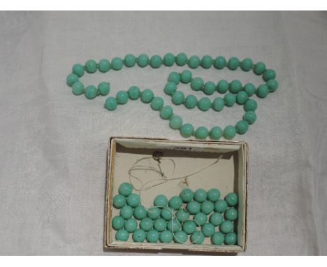 A broken string of jade beads of striped spherical even form,  approx 155g