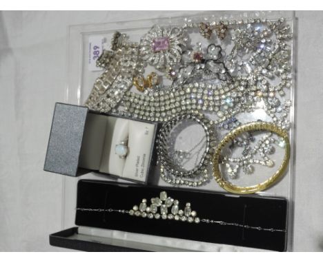 A selection of diamante costume jewellery including earrings, necklaces, brooches and bracelets, and a silver plated faux opa