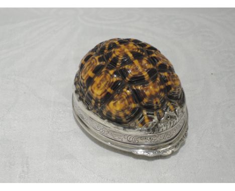 A white metal mounted terrapin shell snuff box/mull having engraved decoration to base and rim with gilt interior, no marks t