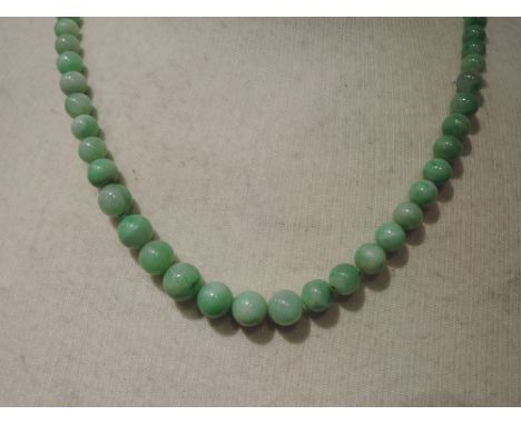 A string of graduated jade beads, approx 20'KNOTTED AT INTERVALS, GOOD CONDITION