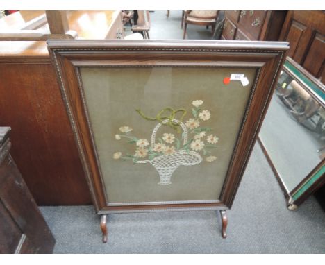 A 1920's scumbled frame firescreen having embroidered panel