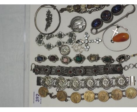 A selection of white metal and HM silver jewellery including woven bracelet, hinged bangle, pendants, musical interest bracel