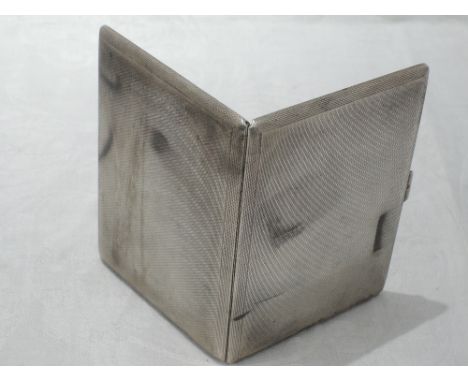 A silver cigarette case having engine turned decoration and bearing monogram to inside, London 1935, S J Rose & SonLOTS OF MA