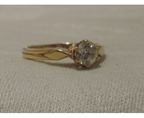 A lady's dress ring having a cubic zirconia solitaire in a raised claw mount on a 14ct gold loop, size K&nbsp; APPROX 2.4G