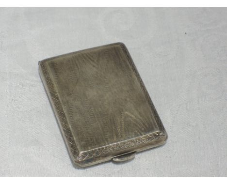 A small silver card holder having engine turned water mark decoration and inscription to inside, Birmingham 1926, S Blanckens