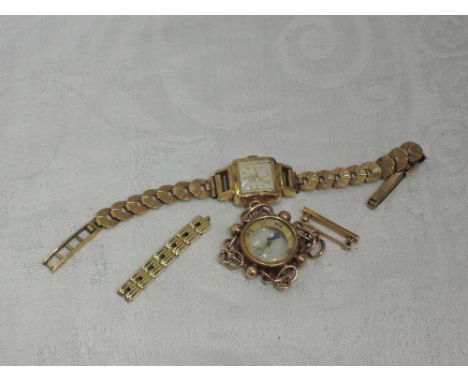 A lady's gold plated wrist watch having a 9ct gold strap and extra links, a small yellow metal bar brooch and a vintage compa
