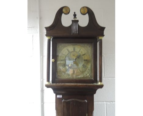 A late 18th century oak longcase clock having swan neck and pillar hood containing brass spandrel face and 30 hour movement b