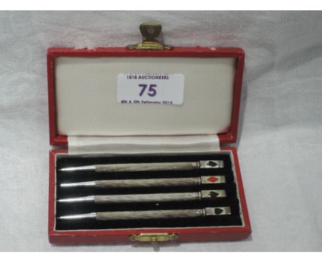 A cased set of four sterling silver bridge pencils having engine turned decorationSTAMPED "STERLING SILVER" BELOW THE SQUARE 