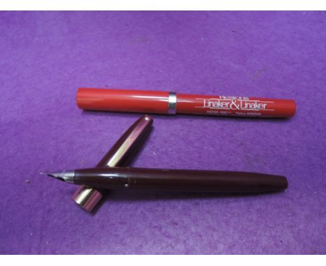 A Sheaffer Valliant with snorkel filler and Sheaffer advertising rollerball
