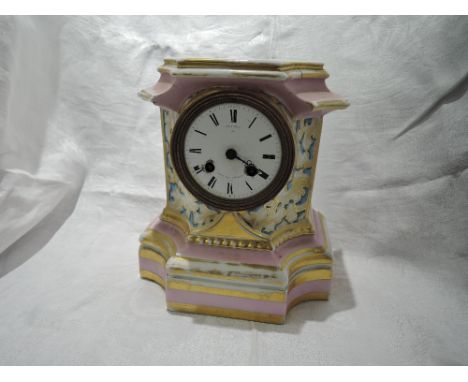 A 19th century French ceramic mantel clock stamped Miroy Paris, Prize Medal 1851, having gilt heightened decoration