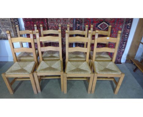 A set of eight modern rush seat ladder back dining chairs - Height 100cm