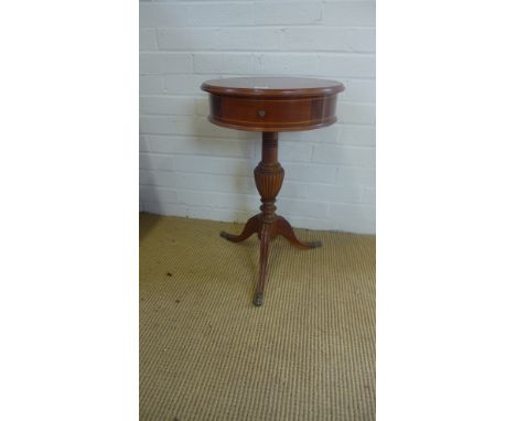 A reproduction mahogany drum type table on tripod base - 63cm x 40cm