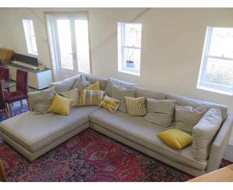 A large grey corner sofa by Crack of Machalke - 320cm x 97cm x 65cm with assorted scatter cushions 