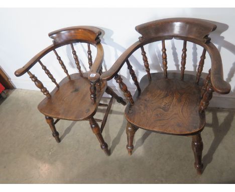 A pair of late 19th century ash and elm smokers bow armchairs