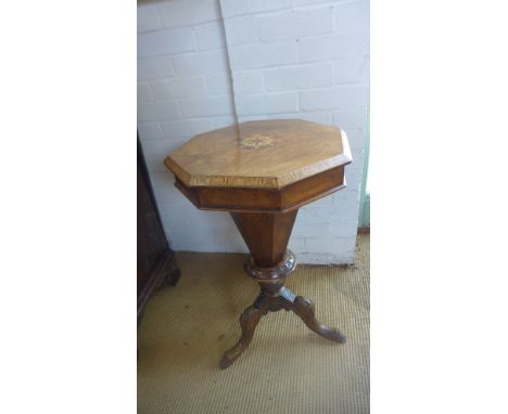 A Victorian trumpet workbox finished in walnut and inlaid to centre, top opening to reveal fitted interior raised on tripod s