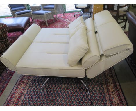 A Designer cream leather and chrome convertable sofa with swivel seats to change to a bed and or chaise - Length 195cm Condit