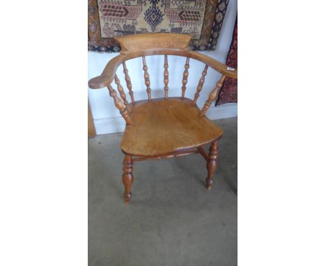 A 19th century smokers bow armchair