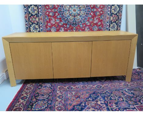 A modern light oak three door sideboard by Skovby of Denmark - model SM83E - 179cm x 73cm x 48cm 