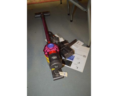 Dyson V7 cordless vacuum cleaner, with charger and operating manual. 