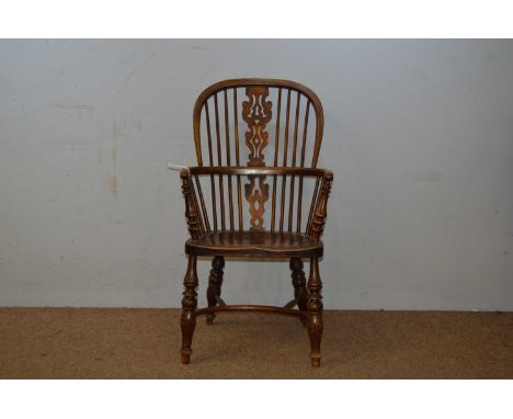 A late 19th/early 20th Century ash and elm Windsor chair, the hoop back with shaped and pierced splats, curved mid rail above
