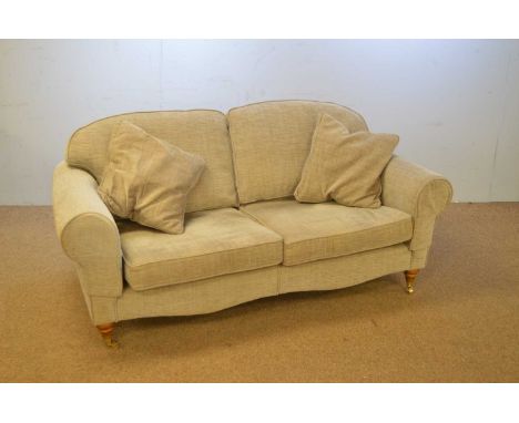 A 20th Century Delcor two-seater sofa, upholstered in grey fabric, with undulating back and stuff-over arms above cushioned s