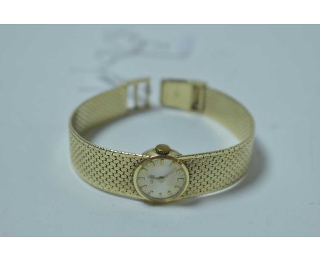 A 14ct yellow gold cased cocktail watch by Ormo, the baton dial with manual wind movement and on tapered mesh strap, 34.2g gr