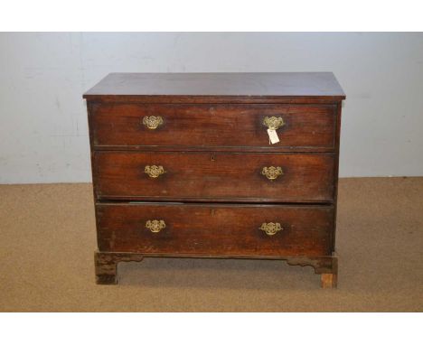 A 19th Century mahogany chest of drawers, the rectangular top above three long graduated drawers, raised on shaped bracket fe