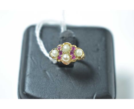 A late Victorian ruby and half pearl ring, in 15ct yellow gold mount. 