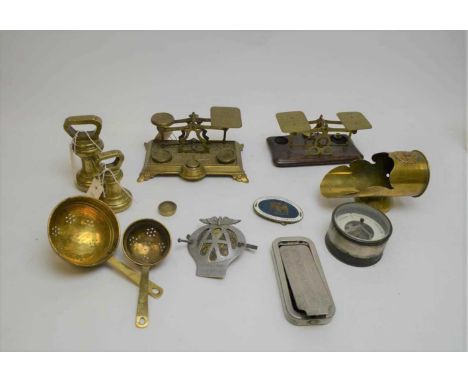 Two sets of brass postal scales; along with other items including brass weights; car badges; an aneroid barometer; and brass 