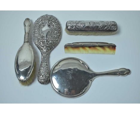 Antique silver dressing table brushes and mirrors, including a matching hand mirror, brush and comb set, marks indistinct, Bi