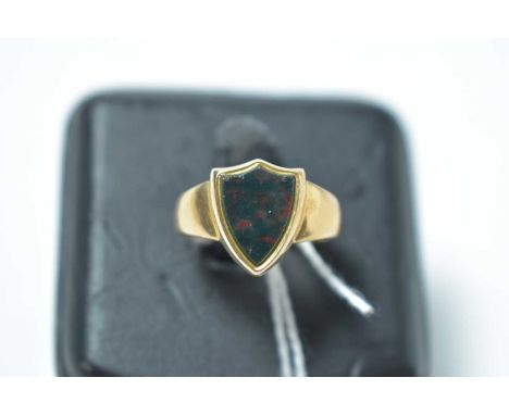 A blood stone signet ring, the shield shaped matrix in 15ct mount and shank, 4.8g gross.