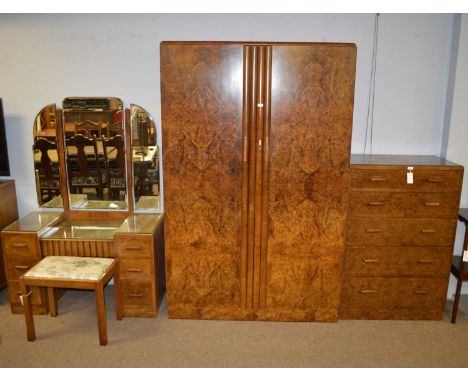 An early 20th Century walnut three-piece bedroom suite, comprising: a two-door wardrobe with caddy top, burr walnut veneer do