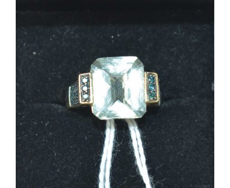 A contemporary 14ct, green amethyst and green gemstone cocktail ring, having a central cushion and facet-cut amethyst, crown 