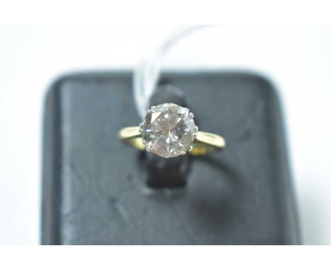 A contemporary diamond solitaire ring of approximately 2ct, crown and cathedral set with chenier shoulders, on high-carat yel